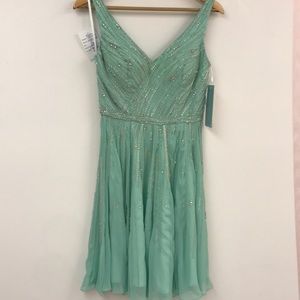 Mint green short beaded formal. NWT Size 2